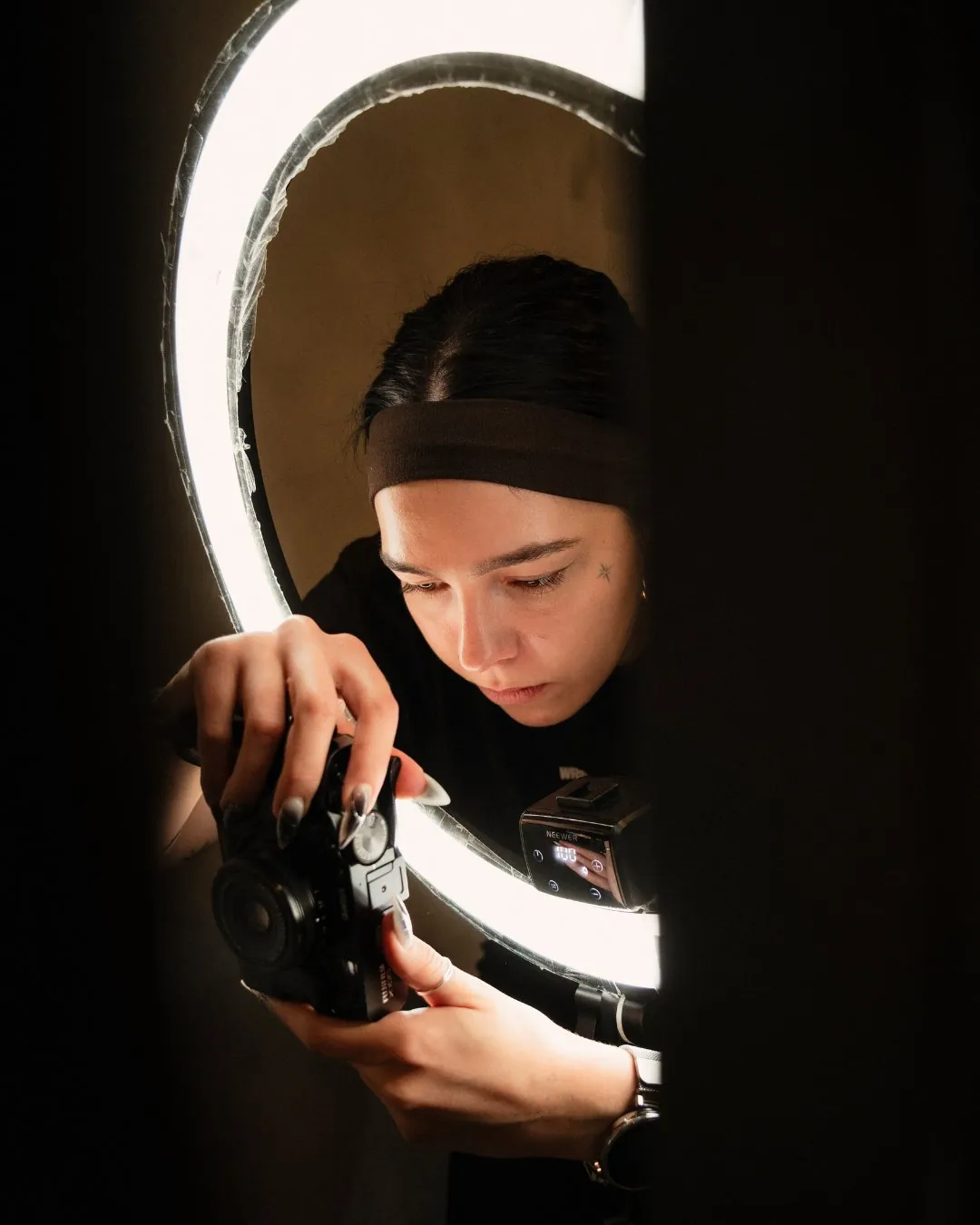 GON Berlin studio photographer framing a shot through a ring light